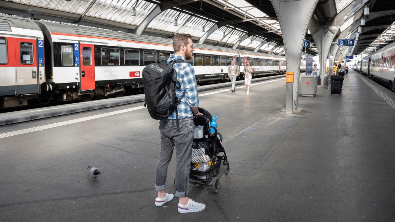 Park your pushchair parallel to the track and apply the brakes.
